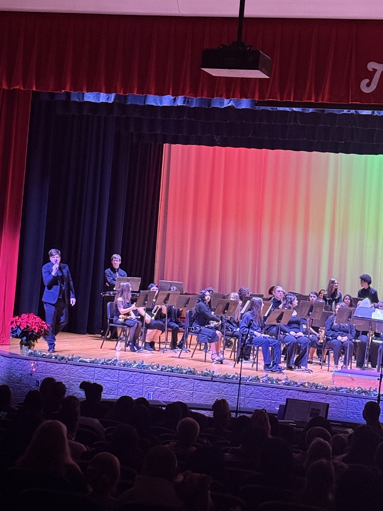 Mr. Ivey welcomes the guests at the Fine Arts Christmas program. 