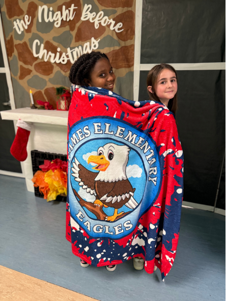 two girls wrapped in blanket