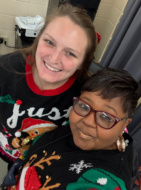 Teachers together wearing their christmas attire