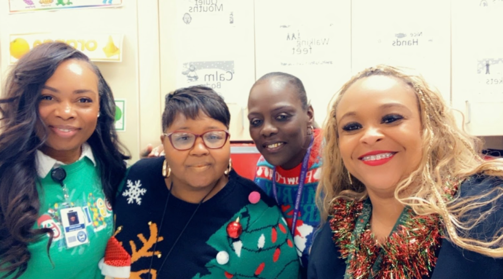 Teachers together wearing their christmas attire