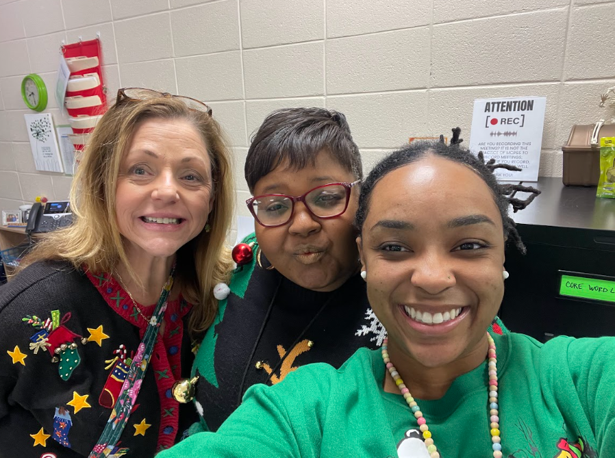 Teachers together wearing their christmas attire