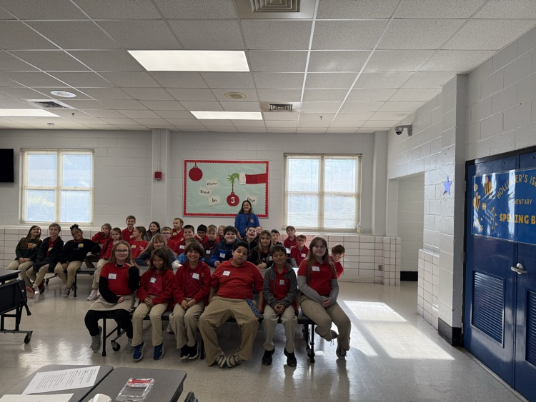 3rd-5th grade students participating in the spelling bee in the cafeteria