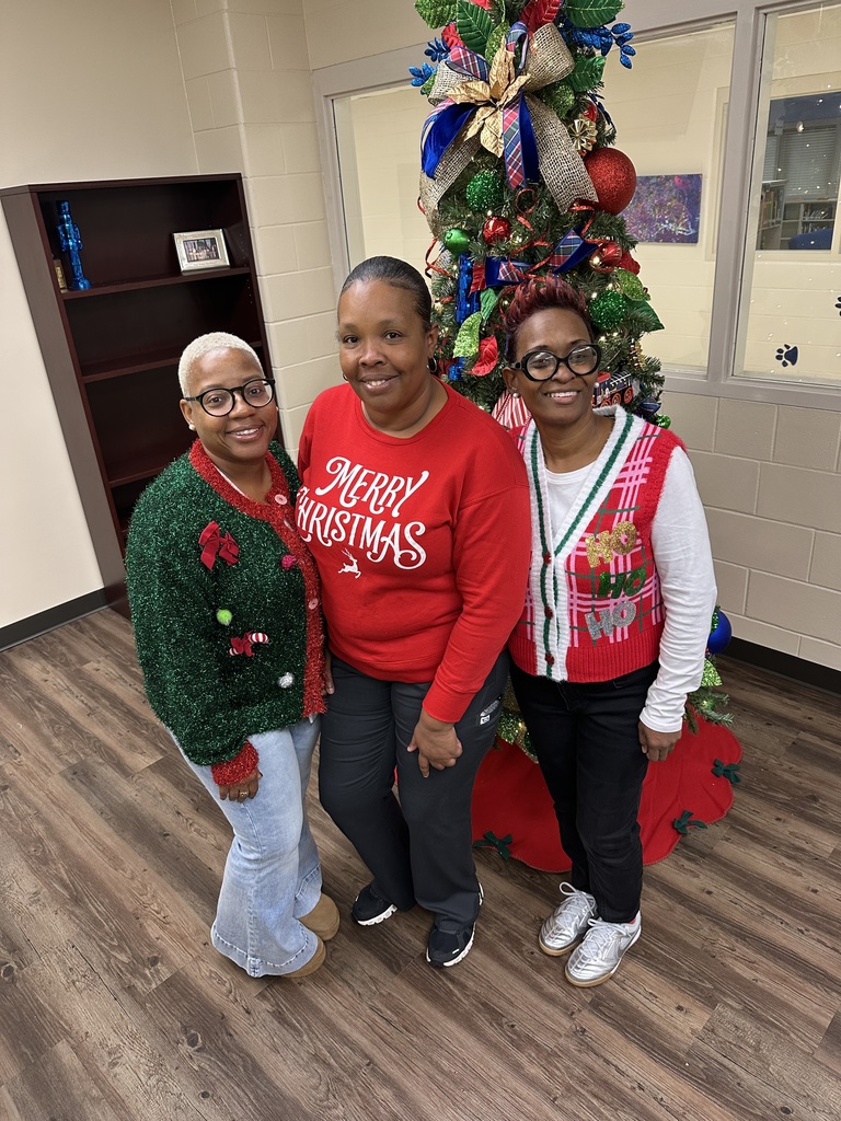 Group staff photo in front of tree