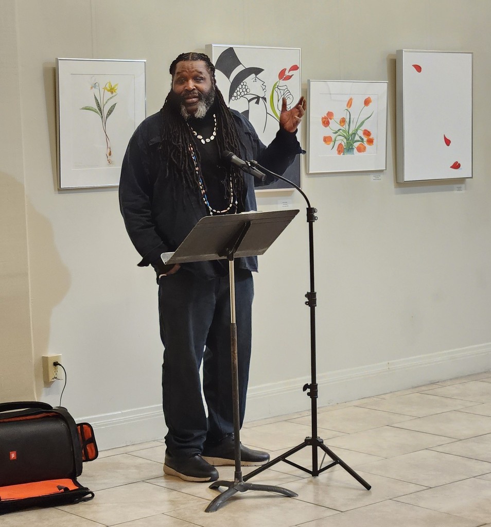 A man speaking at a microphone