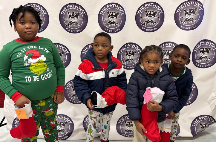 Students with their christmas gifts and stockings