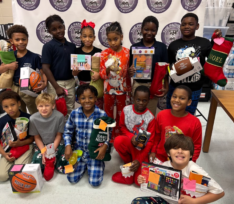 Students with their christmas gifts and stockings