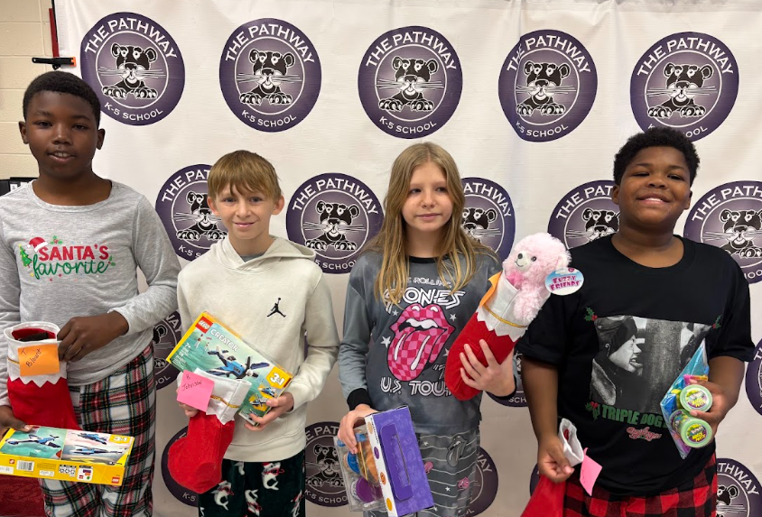 Students with their christmas gifts and stockings