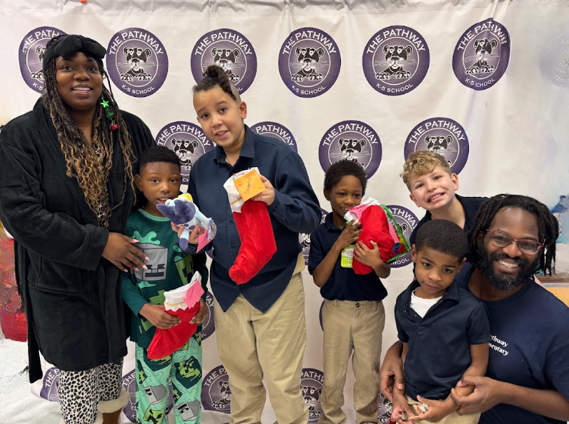 Students with their christmas gifts and stockings 