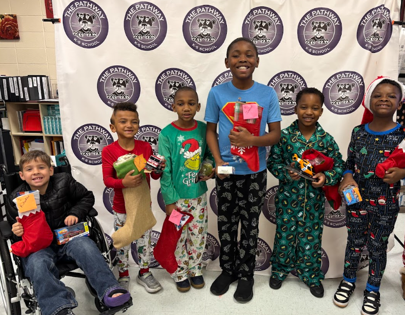 Students with their christmas gifts and stockings