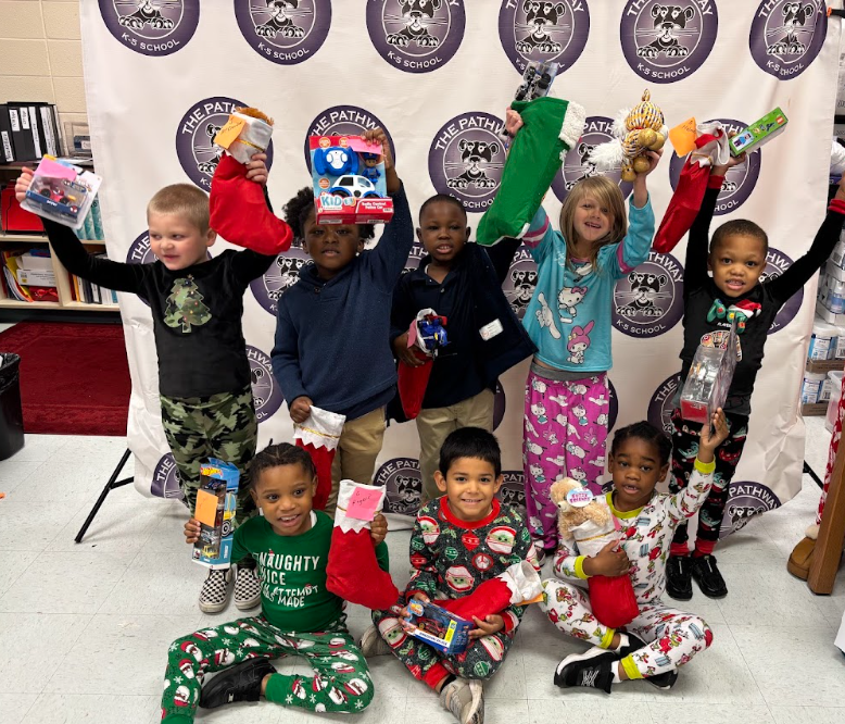 Students with their christmas gifts and stockings