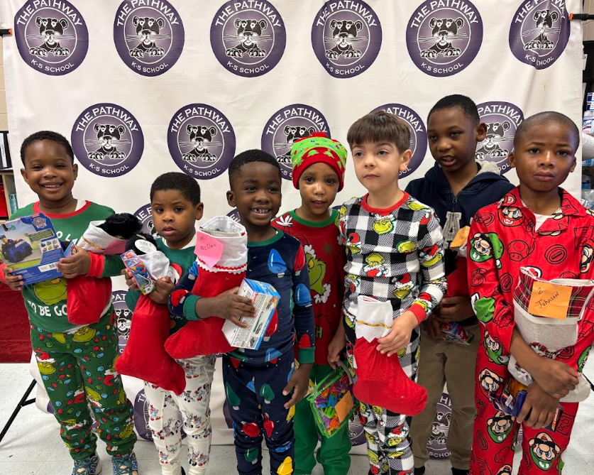 Students with their christmas gifts and stockings