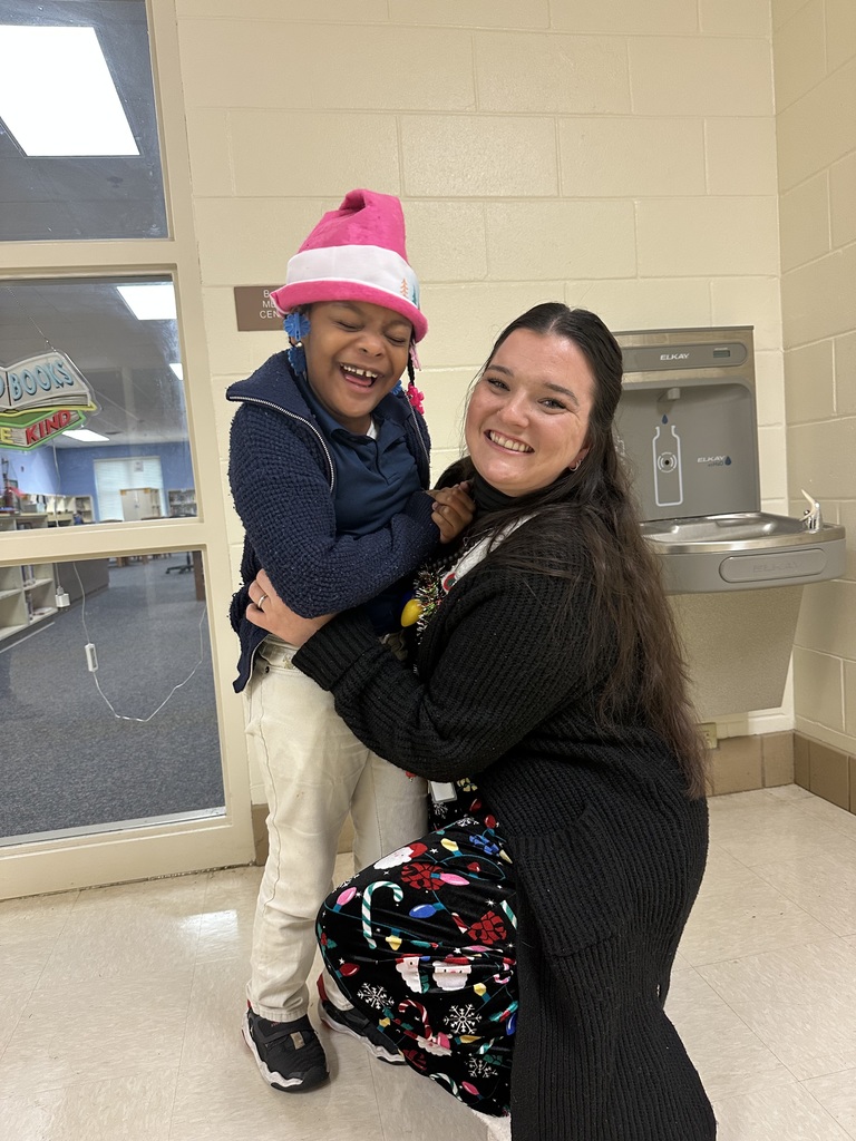 Mrs. Lamier with student 