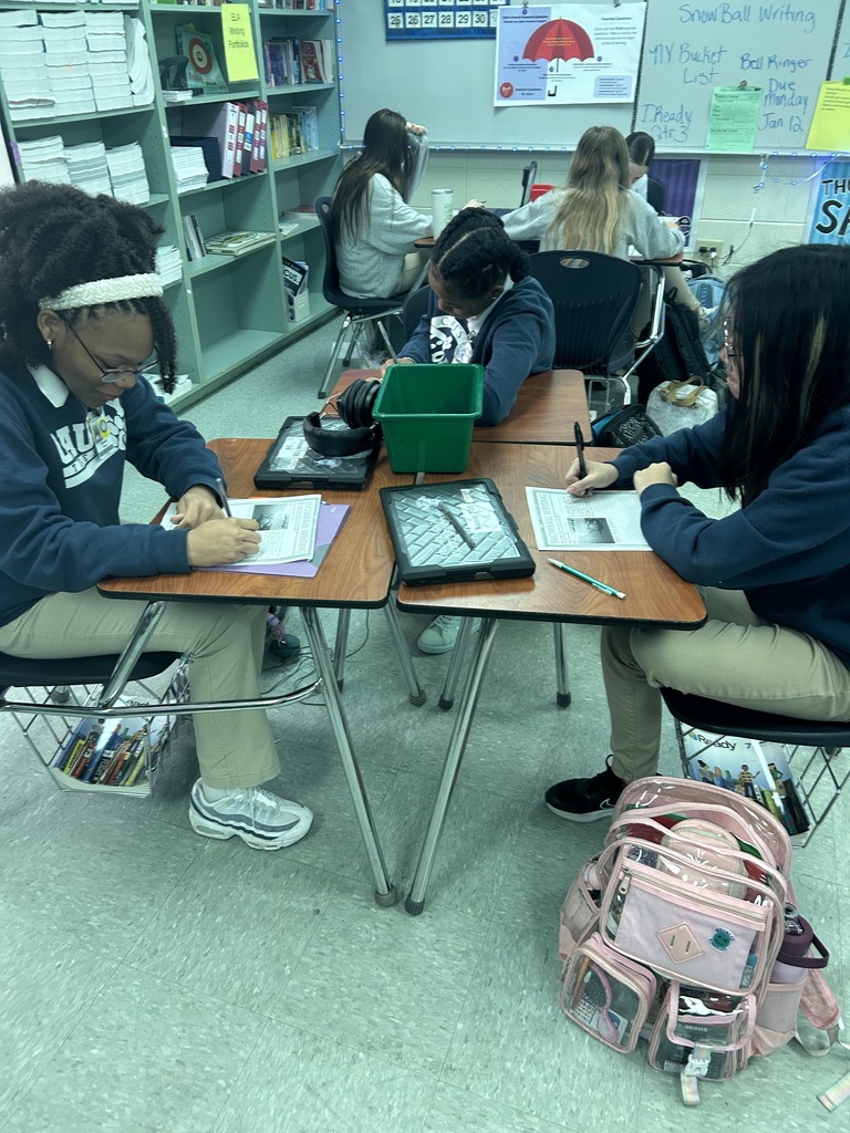Students working at desks in a classroom