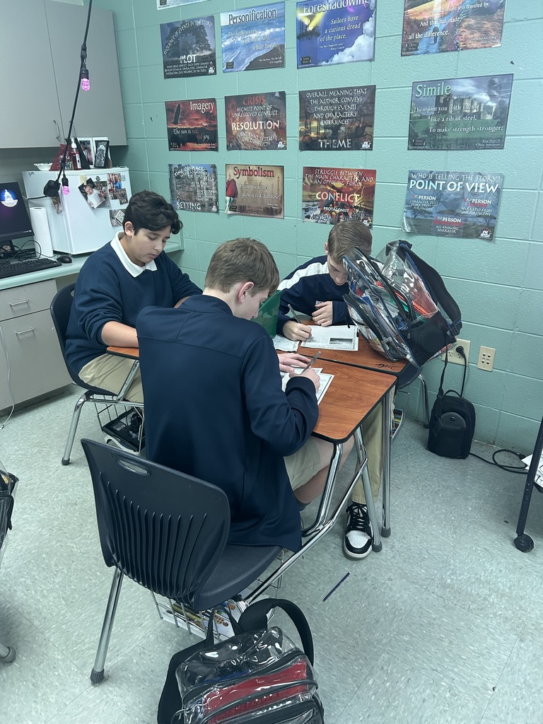 Students working at desks in a classroom