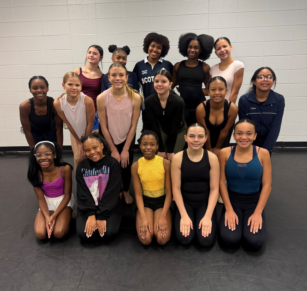A group of middle school dancers and an instructor