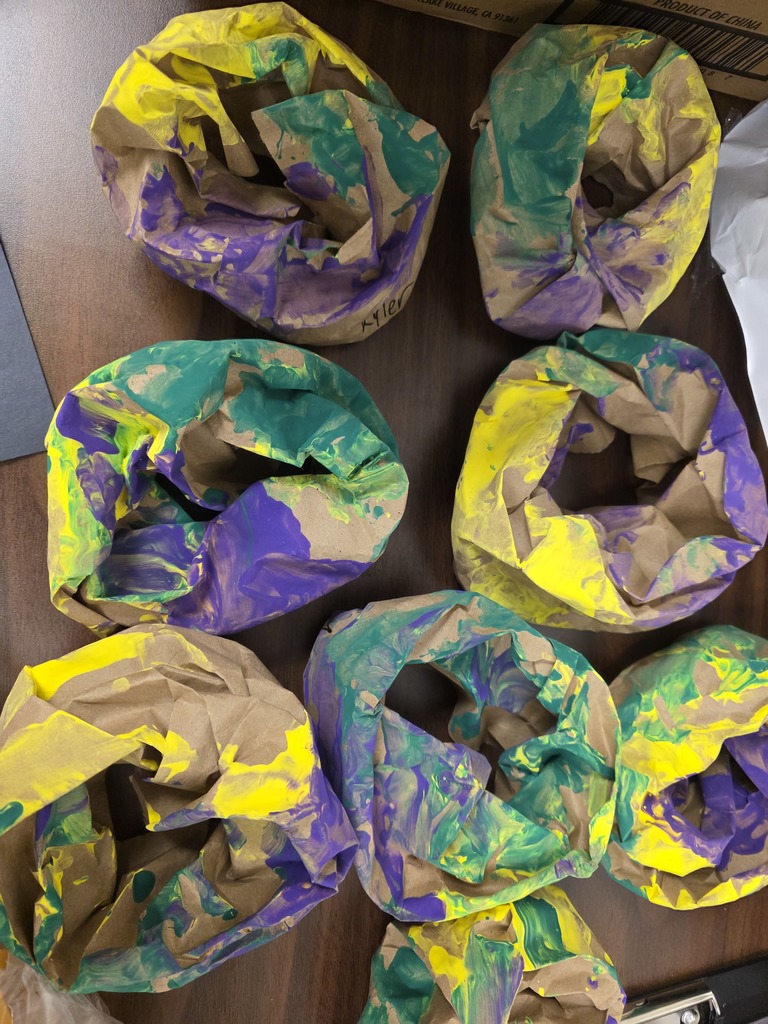 Student creating an art projects with paint 