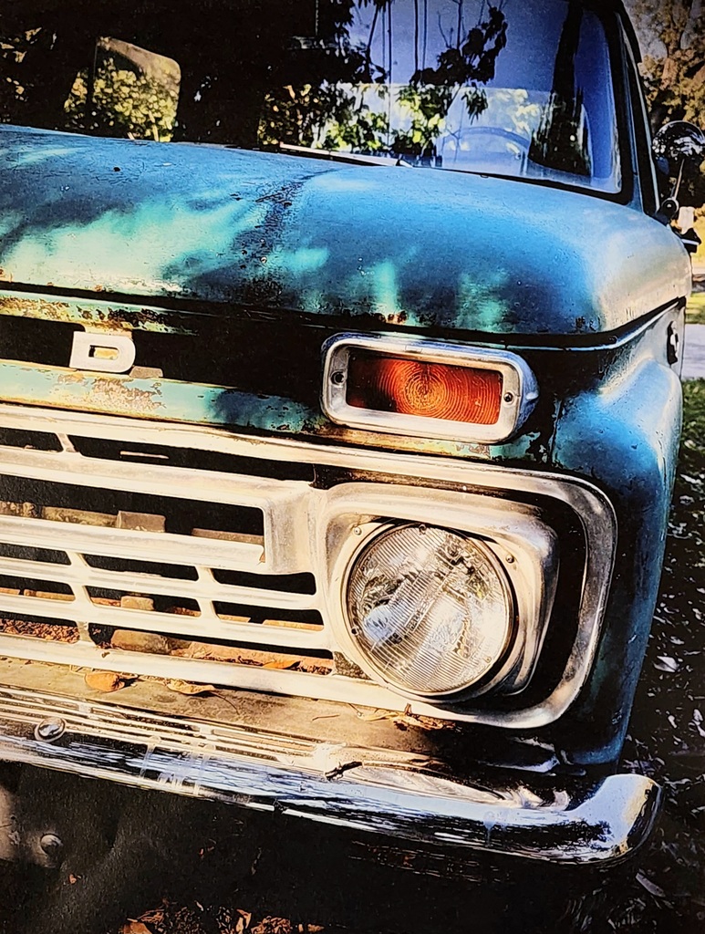 A close-up photo of the front of an old pickup truck
