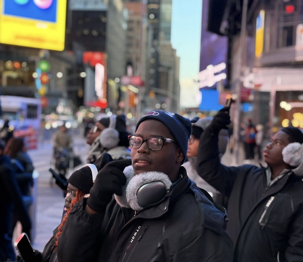 Students looking around at the buildings of New York City