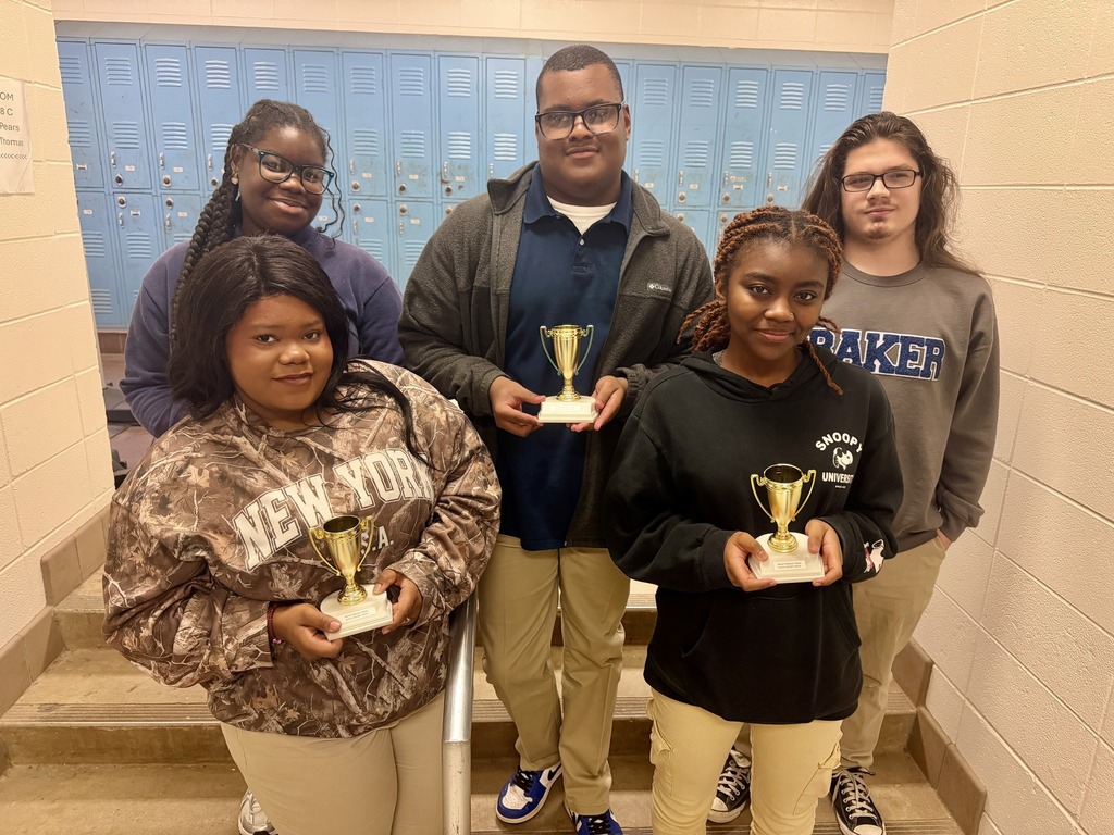 Five high school students holding small trophies