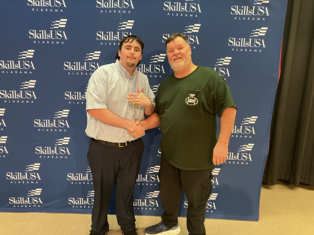 Mr. Knapp (automotive instructor) and Student at Skills USA Competition