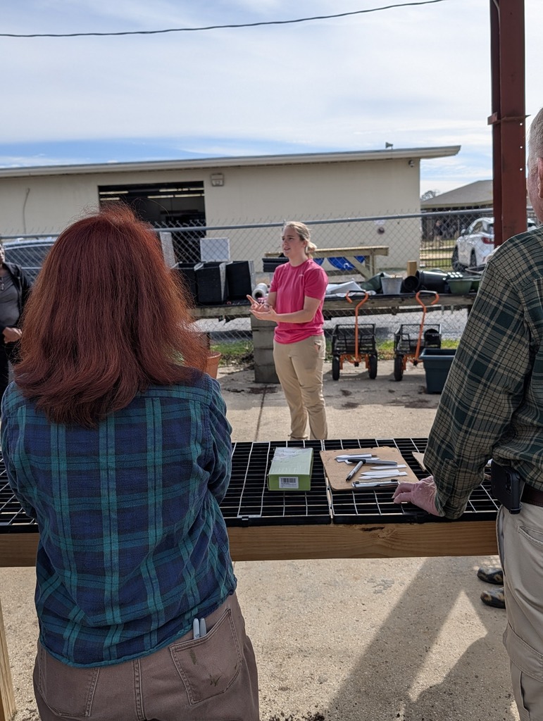 The Mobile County Master Gardeners  (MCMG) helping transplant seedlings and getting a closer look at our potting mix.