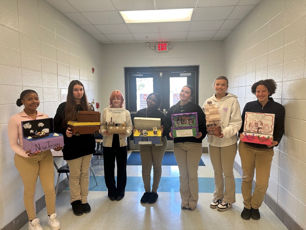 Dual Enrollment U.S. History students displaying their completed research projects with a creative twist!