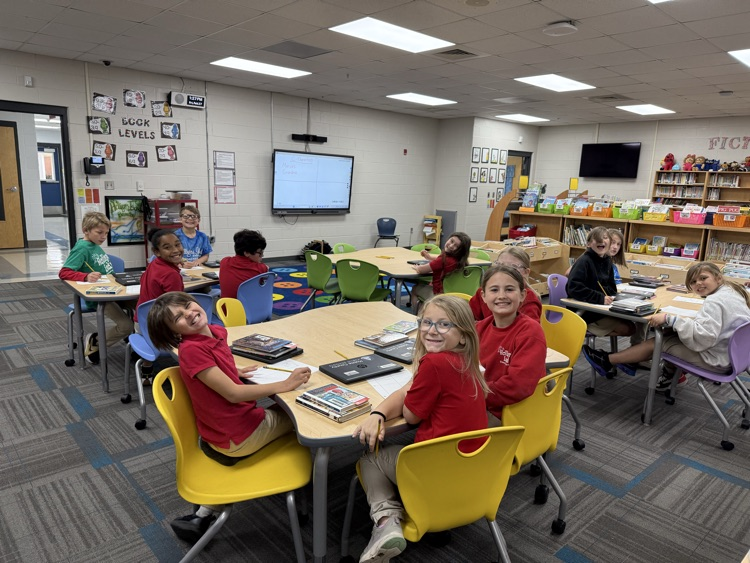 third grade prewriting at tables in the library