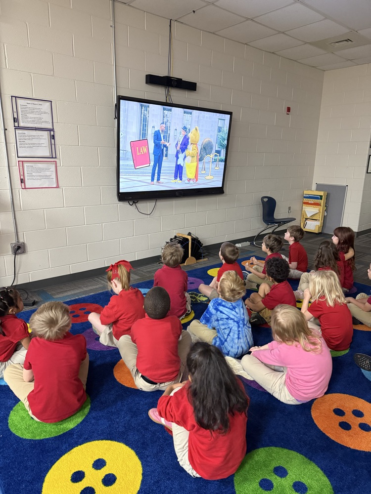 kindergarten class watching short the squirrel in the library 