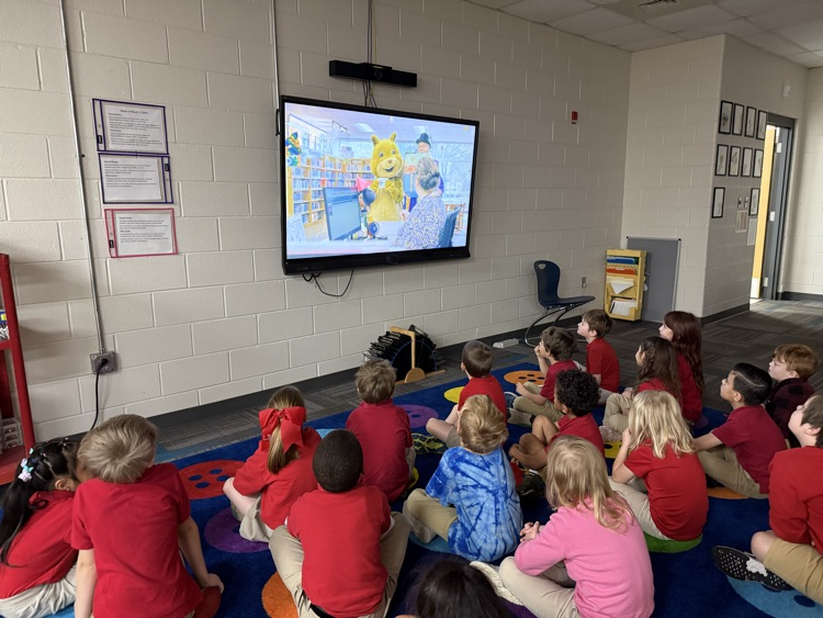 kindergarten class watching short the squirrel in the library 