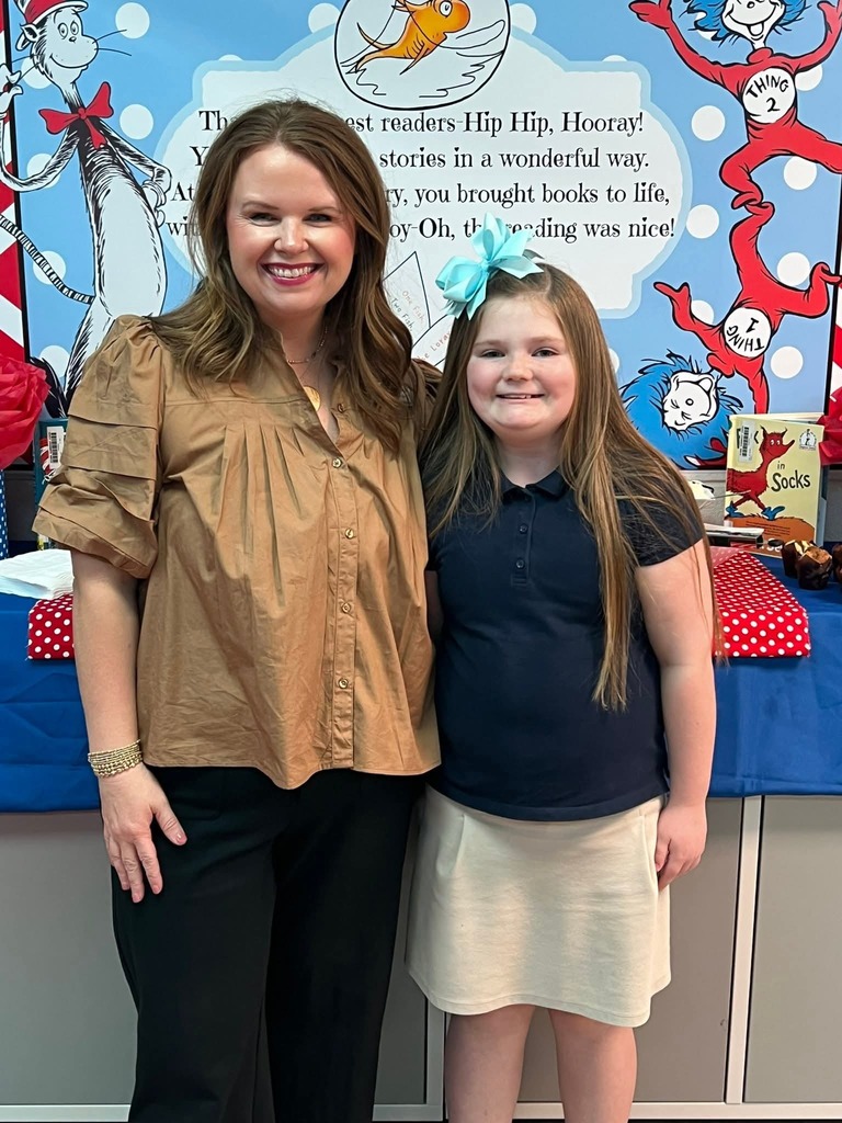 Ms. McAnally with a student.