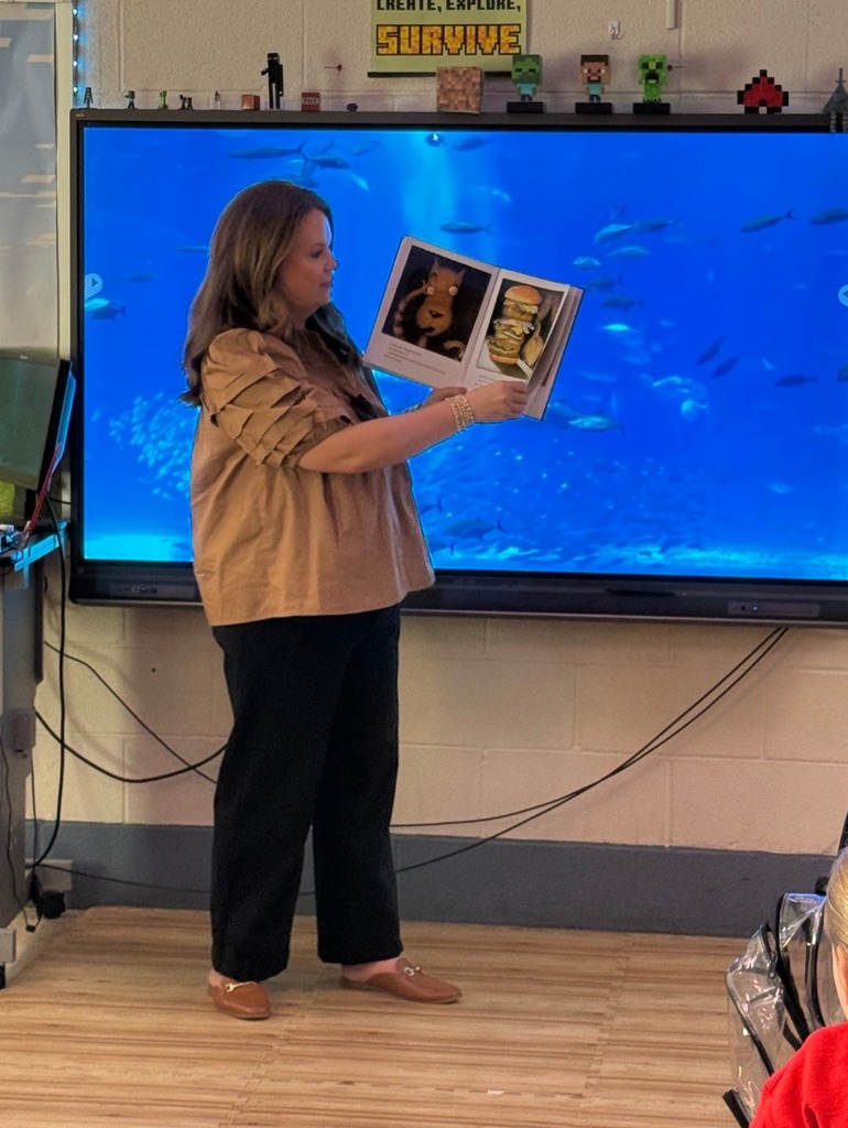 Ms. McAnally reading to a class.