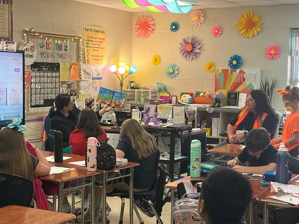 Mrs. Price reading to a class.