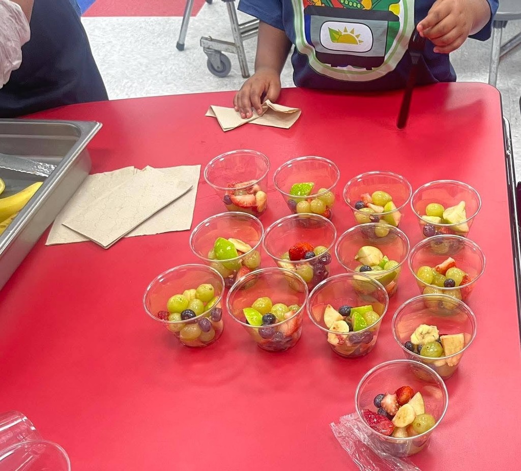 Cups of fruit on a table