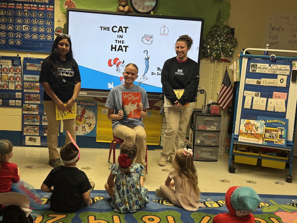 Students from our National English Honor Society (NEHS) and Future Business Leaders of America (FBLA) celebrating Read Across America .