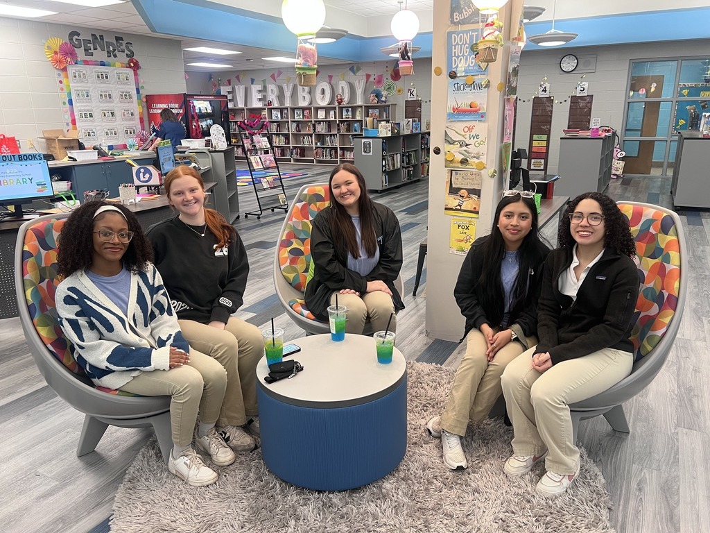 Students from our National English Honor Society (NEHS) and Future Business Leaders of America (FBLA) celebrating Read Across America .