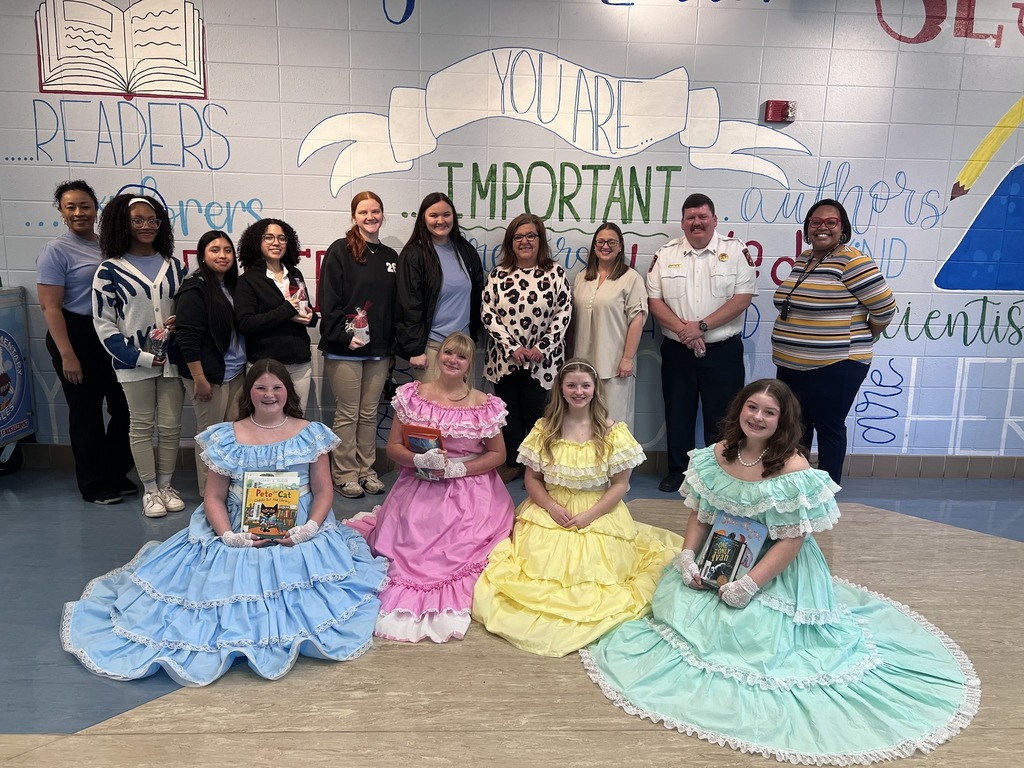 Students from our National English Honor Society (NEHS) and Future Business Leaders of America (FBLA) celebrating Read Across America .