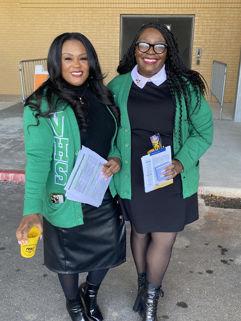 A woman and a student in green Vigor sweaters