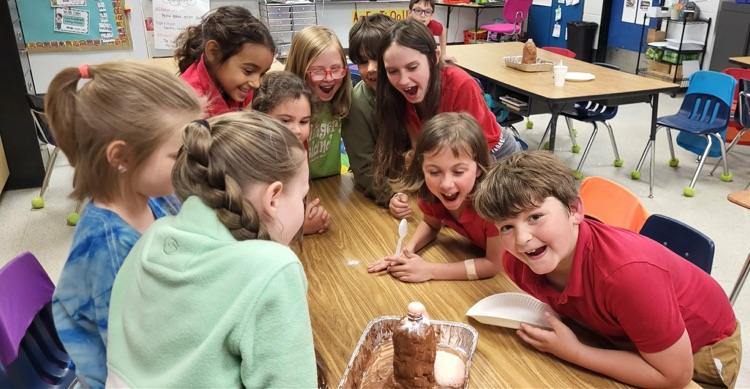 second graders in Mrs. Caballero’s class creating volcanoes to see quick land changes  