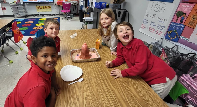 second graders in Mrs. Caballero’s class creating volcanoes to see quick land changes. 