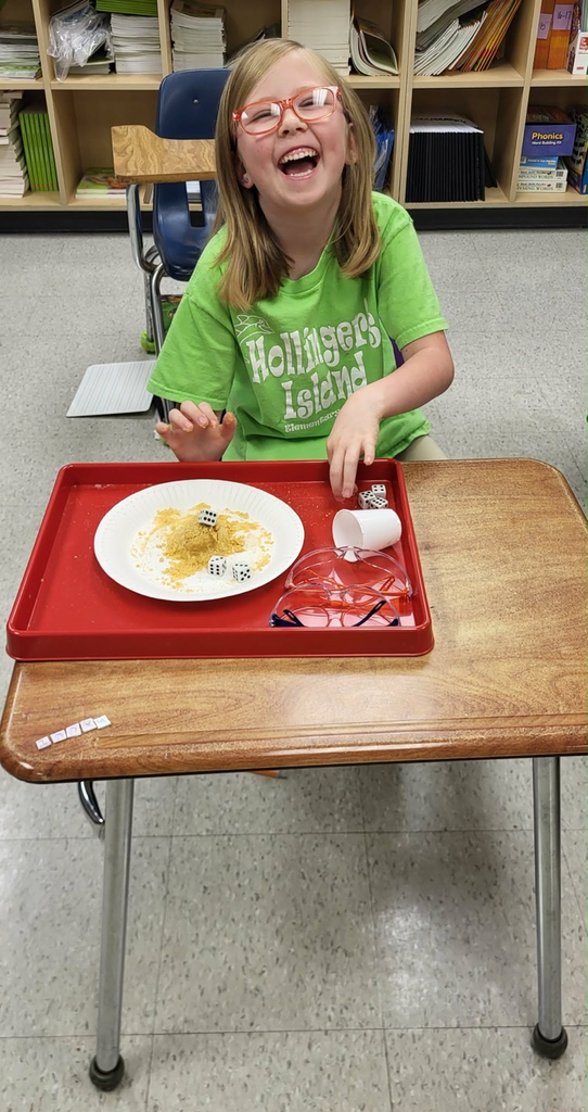 second graders in Mrs. Caballero’s class creating earthquakes to see quick land changes. 