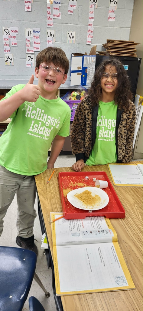 second graders in Mrs. Caballero’s class creating earthquakes to see quick land changes. 