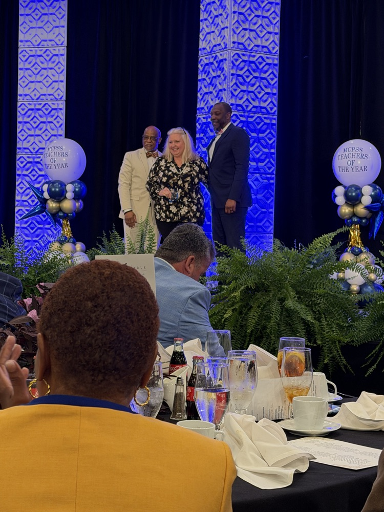 Angela shaking hands 