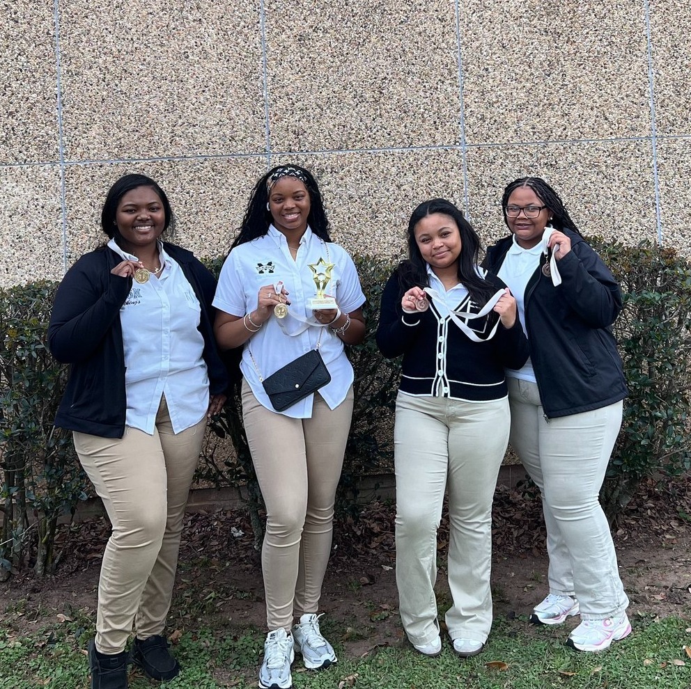 Students who competed in the Region 7 Tech Fair holding their awards.