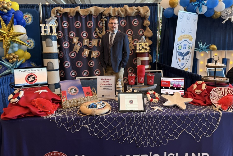 mr. roberston at the hollinger’s island career fair booth