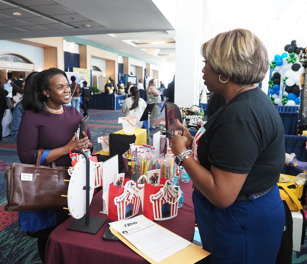 A job-seeker talking with the principal of Chastang-Fournier K-8