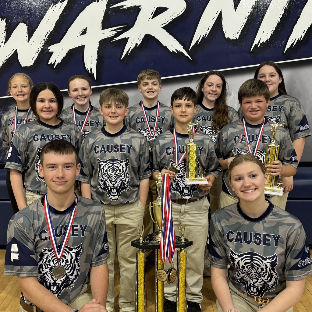 Archery team with trophy from tournament