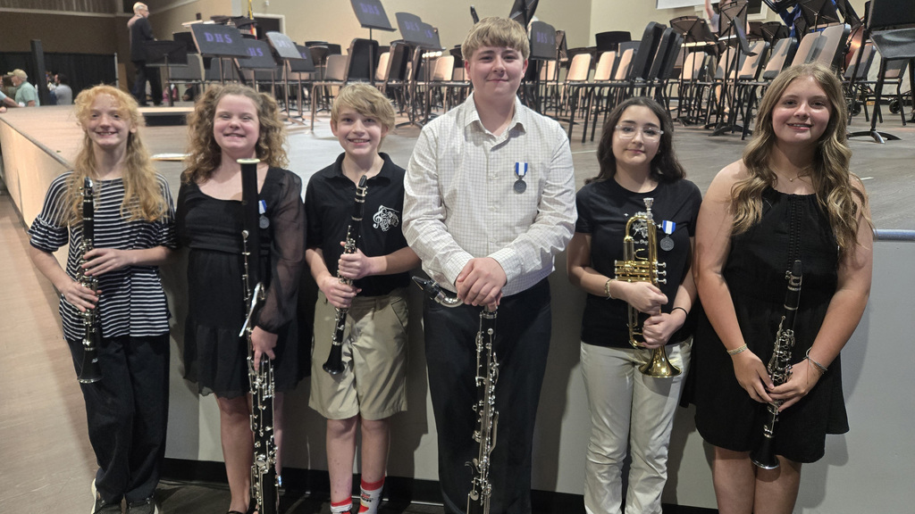 Honor Band performers with instruments at performance.