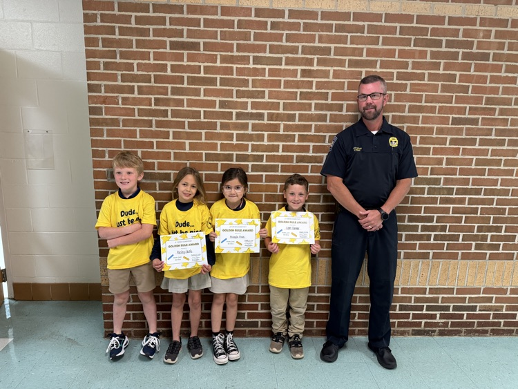 Chief Friend with first grade golden rule students