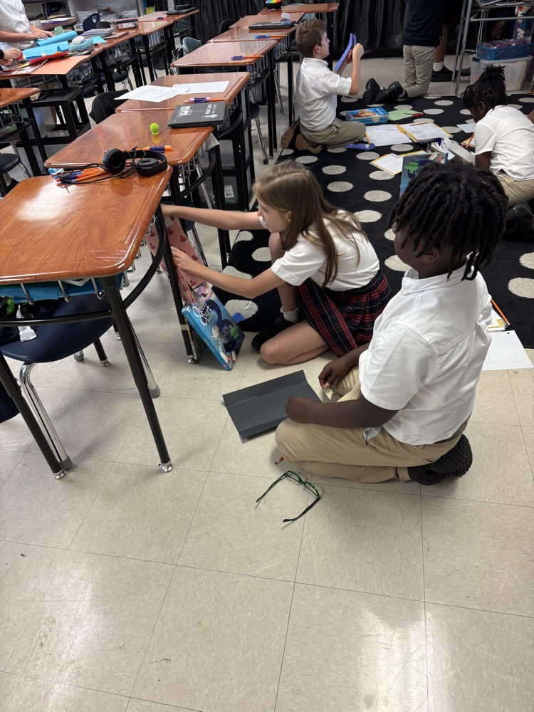 third graders doing a science experiment