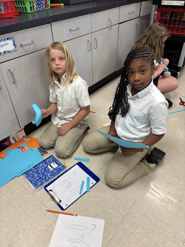 third graders doing a science experiment